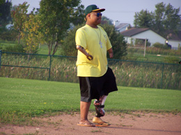 Softball player in Yellow Shirt in outfield